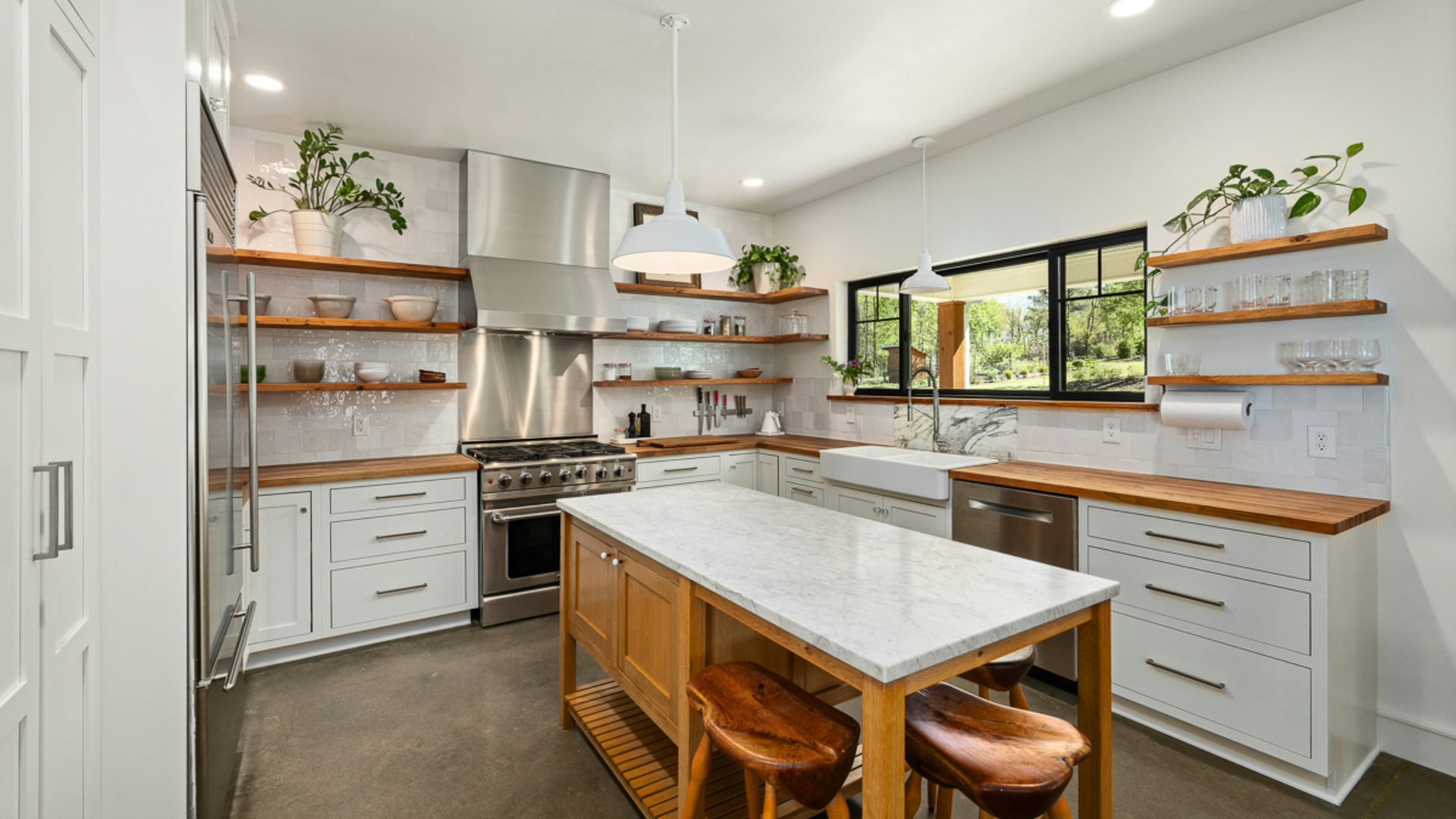 Bright finished kitchen with white cabinetry, island bench and timber accents